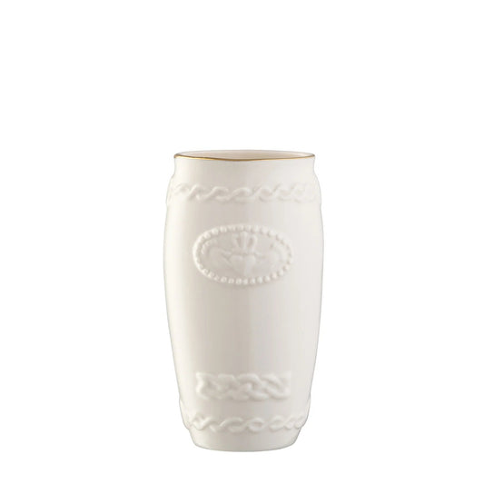 Small porcelain vase with an embossed claddagh on the front and a gold rim.