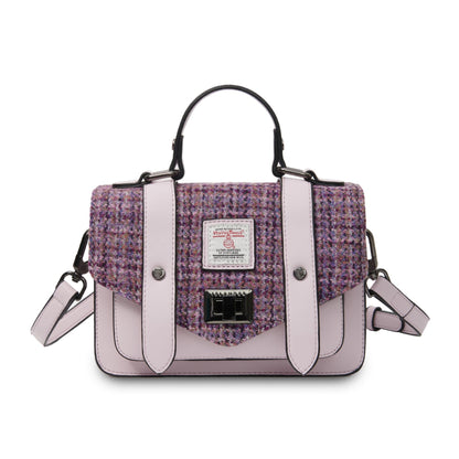 Purple and pink handbag with a visible brand label on a white background