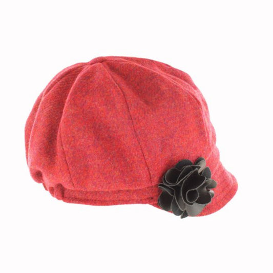 Red cap with a black flower accessory on a white background
