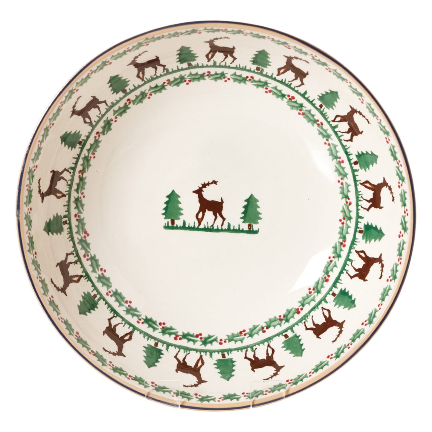 Decorative plate with reindeer and tree design on a white background