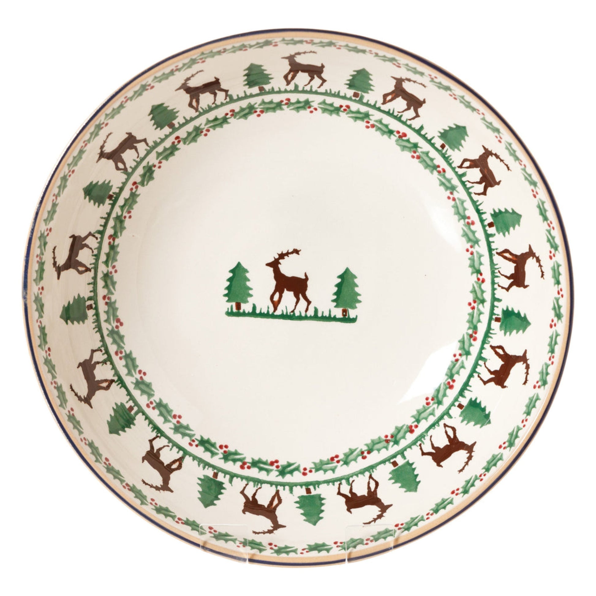 Decorative plate with reindeer and tree design on a white background