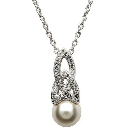 A Celtic pearl necklace adorned with sparkling crystals, featuring a round white pearl as the central stone, suspended from a decorative silver knotwork charm, on a silver belcher chain.