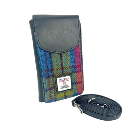 Harris Tweed pouch with plaid pattern and leather strap on a white background