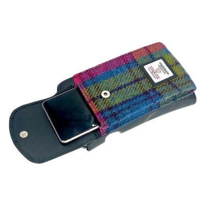 Phone case with plaid design and visible brand label on a white background