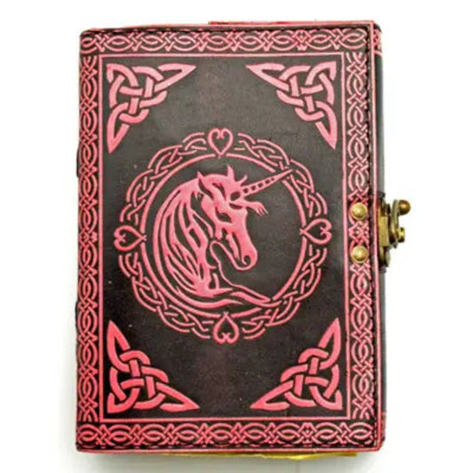 Decorative notebook with unicorn design on a black background