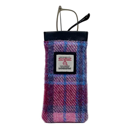 Plaid glasses case with a visible brand label on a white background