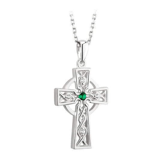 Silver cross pendant with a green gemstone on a white background