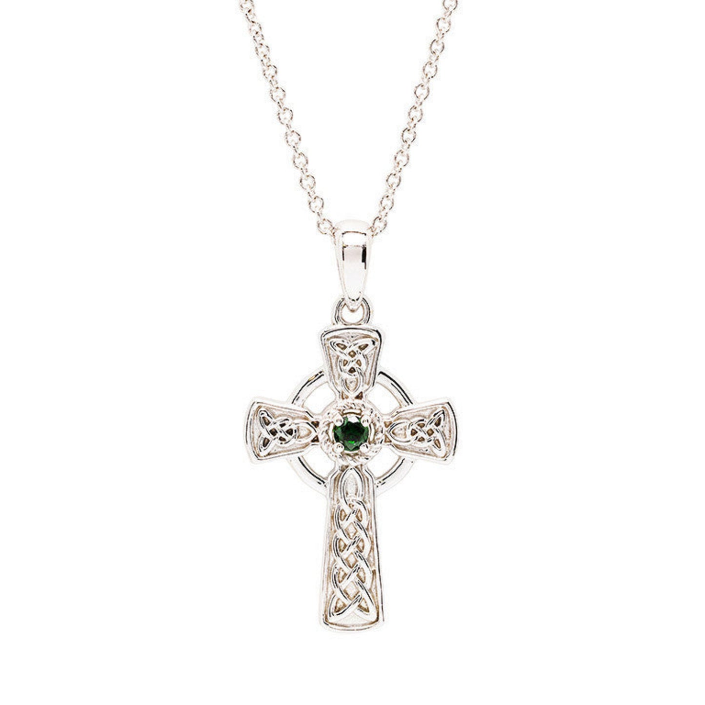 Silver Celtic cross pendant with a green gemstone on a white background