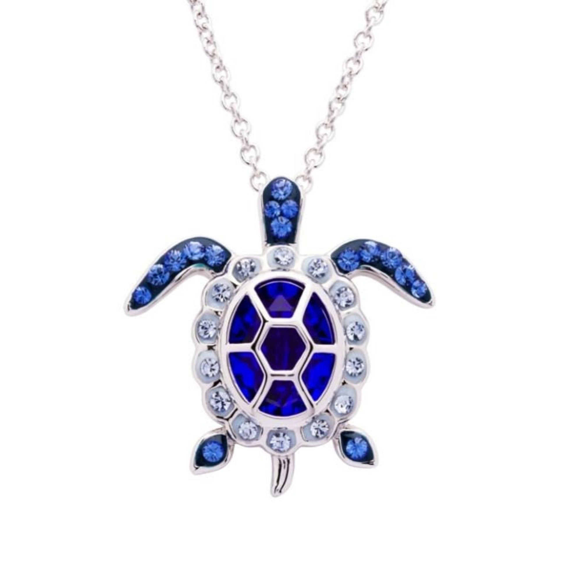 Turtle-shaped necklace with blue gemstones on a white background