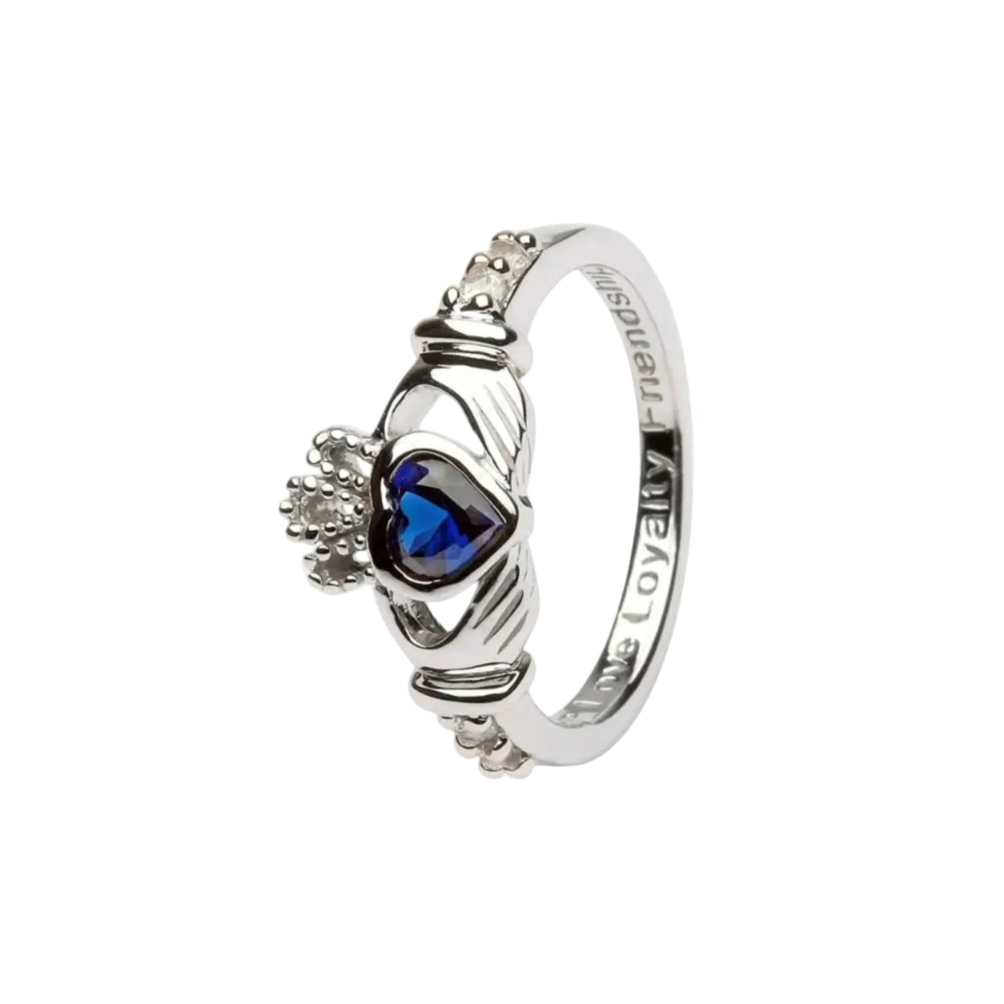 A sterling silver claddagh ring with a blue heart-shaped gem in the center.