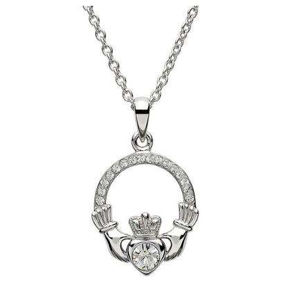 Silver claddagh pendant encrusted with white gems. The heart in the center contains one larger white gem. 