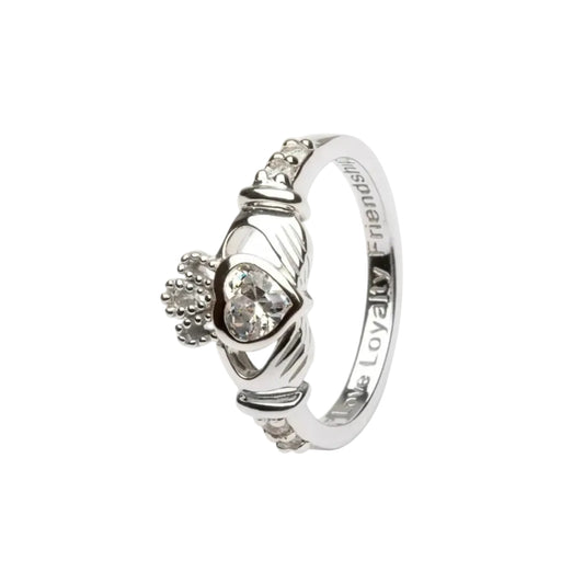A sterling silver claddagh ring with a clear white heart-shaped gem in the center.