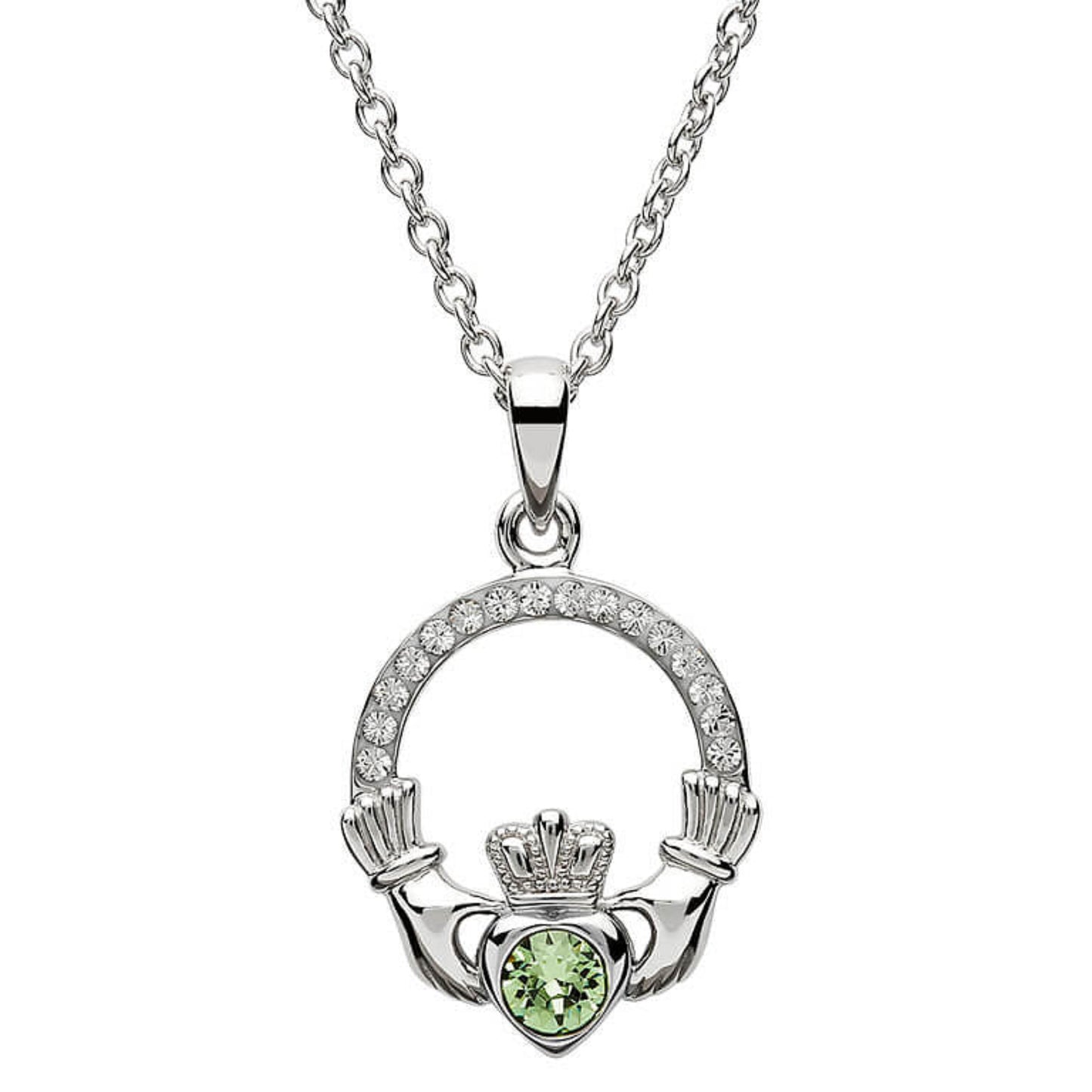 Silver claddagh pendant encrusted with white gems. The heart in the center contains one larger mint green gem. 