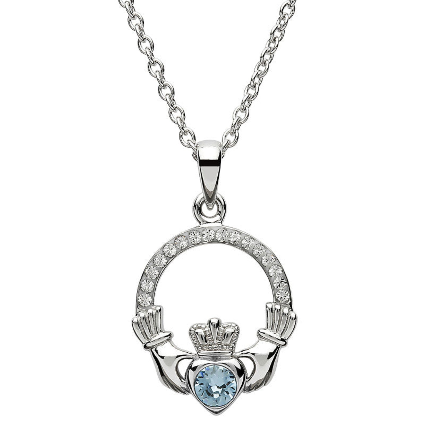 Silver claddagh pendant encrusted with white gems. The heart in the center contains one larger light blue gem. 