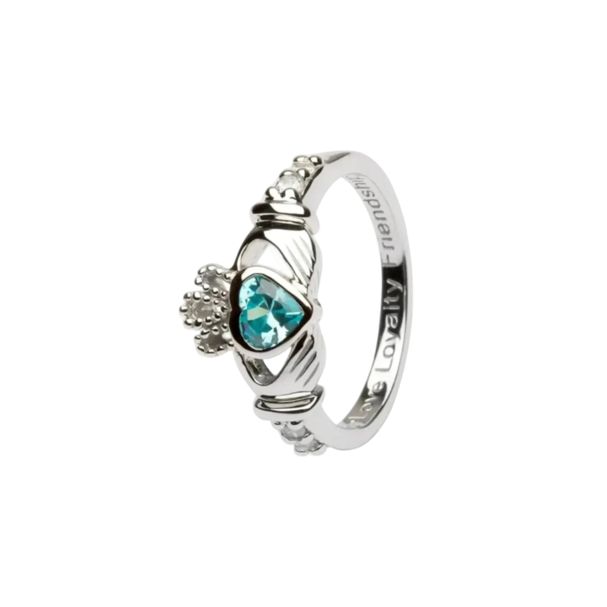 A sterling silver claddagh ring with a teal-blue heart-shaped gem in the center.