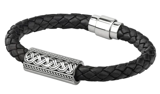 A silver Celtic knot pattern on a black leather bracelet with a metal clasp.