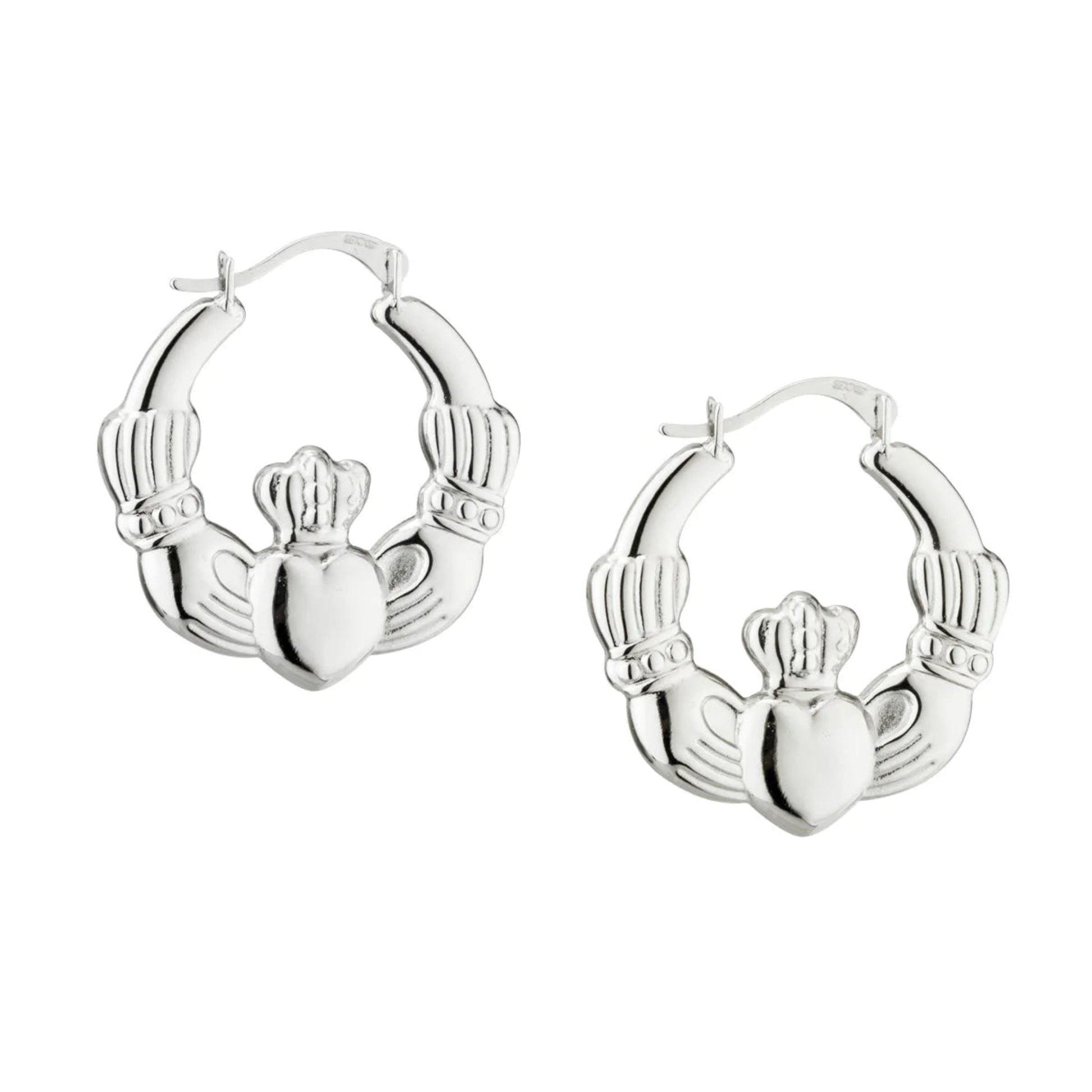 A pair of silver Creole earrings with a Claddagh design.