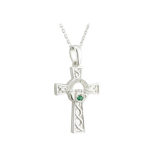Silver cross pendant with a green gemstone on a white background