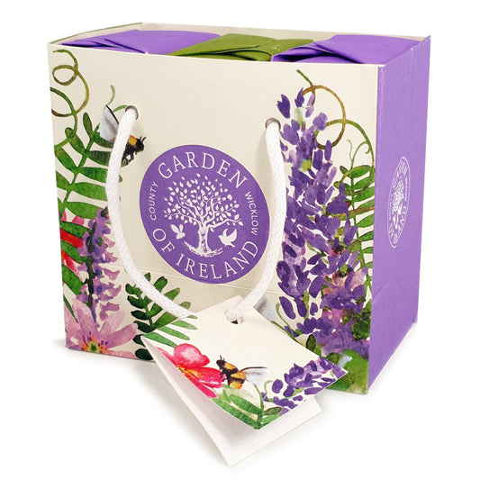 Gift bag with 'Garden of Ireland' branding and floral design on a white background