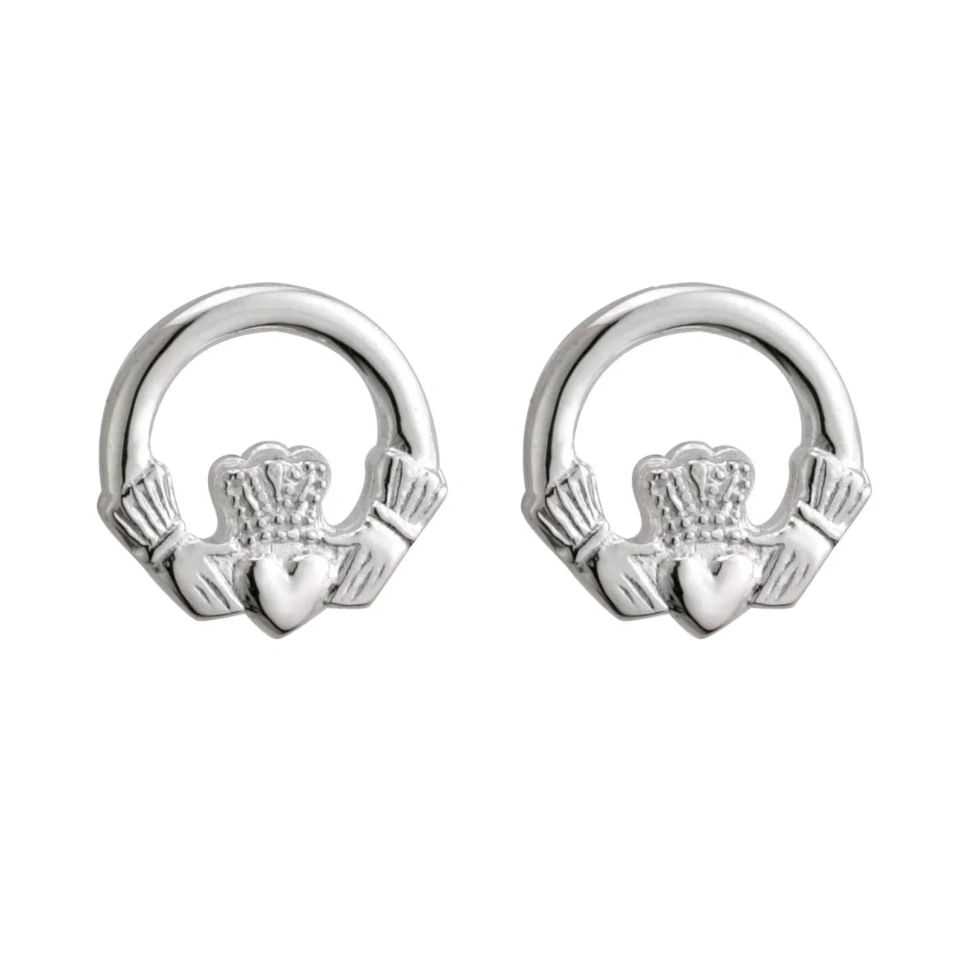 Two small silver earrings in the shape of rounded claddaghs.