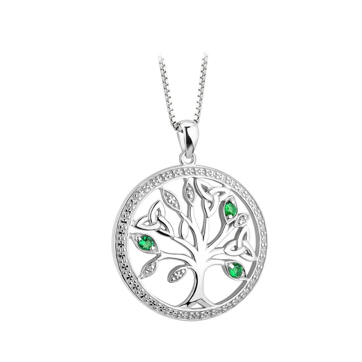 A silver-toned round necklace with crystals on the outer edge and a tree of lief symbol in the center. Green stone accents on the tree's leaves.