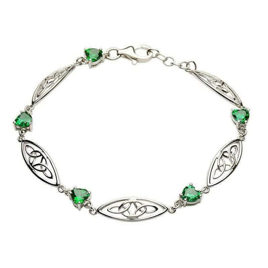 A sterling silver bracelet featuring a heart-shaped green cubic zirconia with trinity knots design.