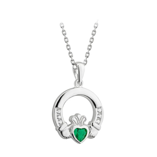 Silver Claddagh pendant with a green heart stone on a white background