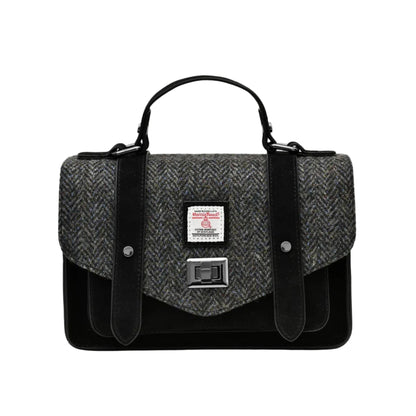 A black and gray Harris Tweed satchel handbag with a microfiber leather exterior and a structured design.