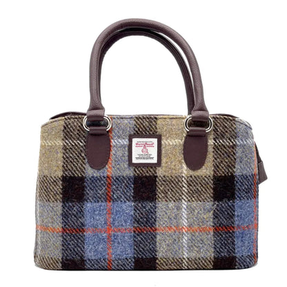Plaid handbag with brown handles on a white background
