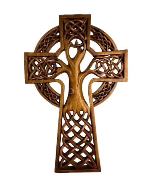 A wooden carving of the Tree of Life Cross with Celtic knotwork.