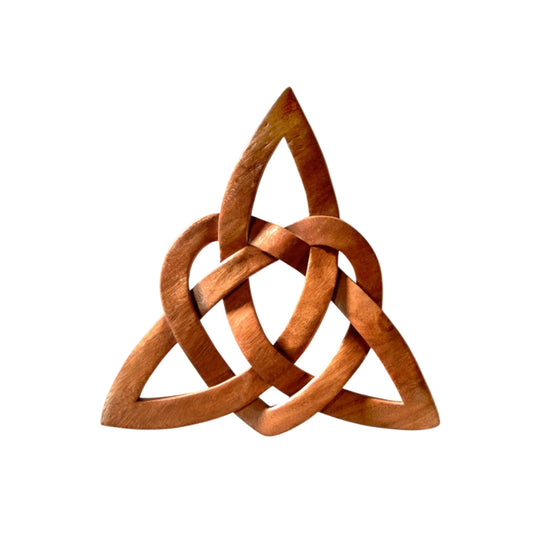 A wooden trinity knot sculpture with a triangular shape and interlaced design.