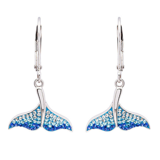Earrings shaped like whale tails with blue and silver design on a white background