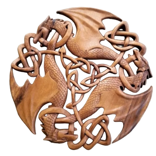 Wooden dragon sculpture with intricate carvings on a stone background