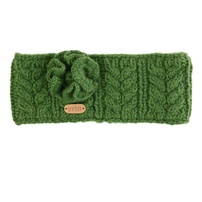 Green knitted headband with a brand label on a white background