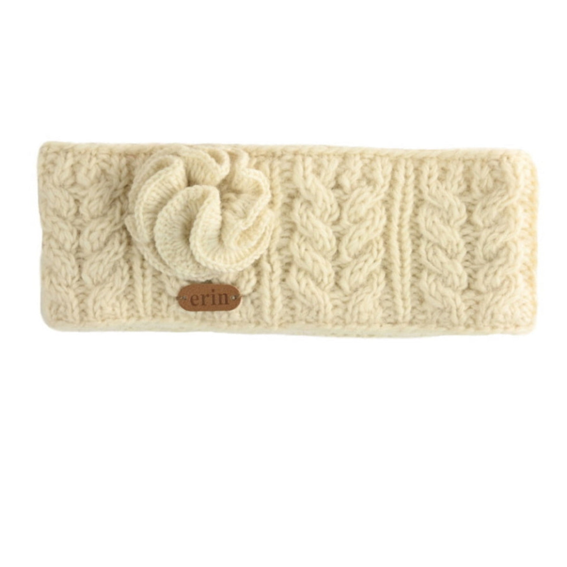 Cream-colored knitted headband with a flower detail on a white background