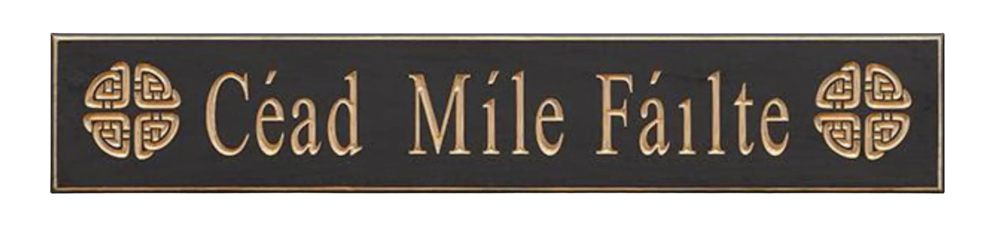 Decorative sign with 'Cáid Móile Fáilte' in gold on a black background