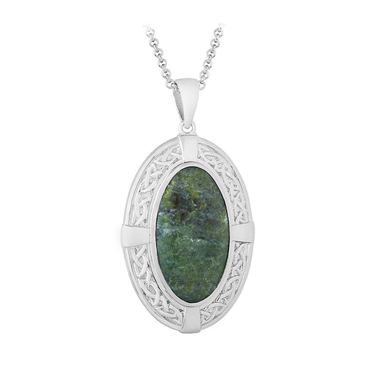 Silver pendant with green stone on a white background