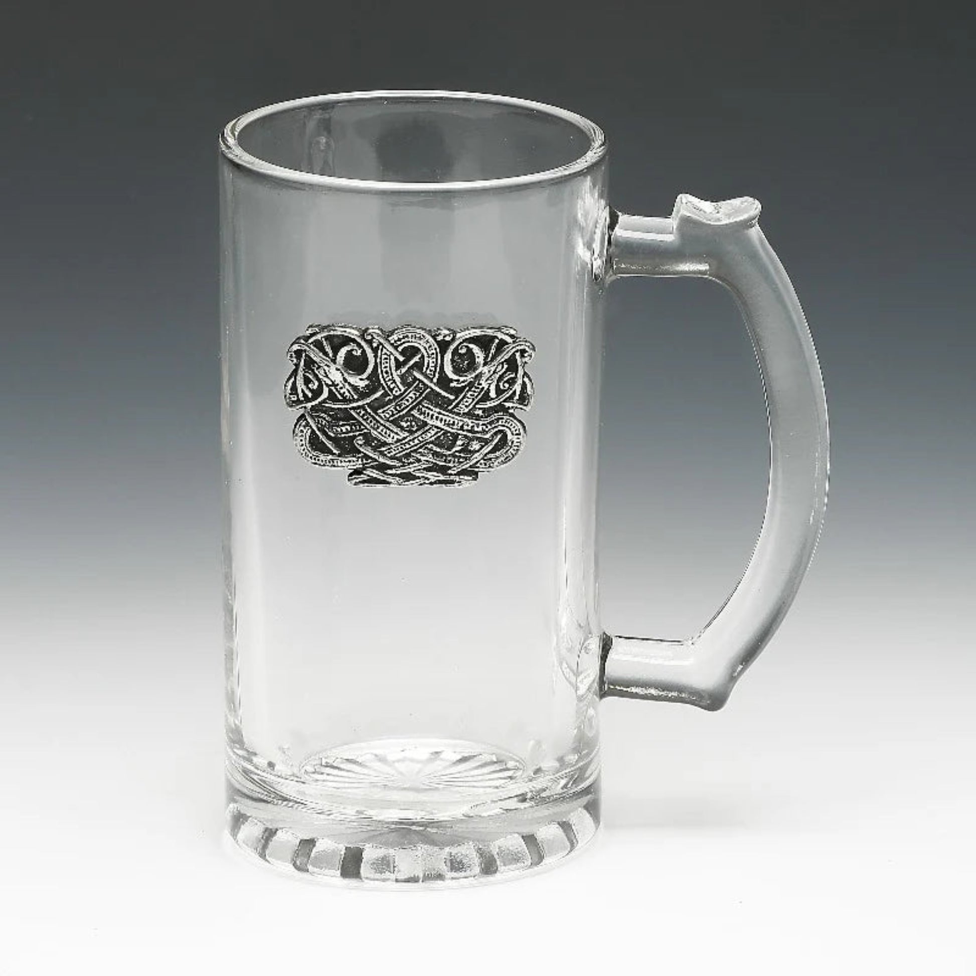 A set of clear glass beer tankards with pewter detailing, displayed on a table with autumnal decorations.