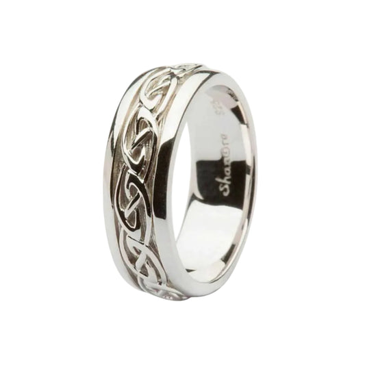 A sterling silver wedding ring with a Celtic knotwork design.