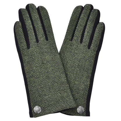Pair of green herringbone patterned gloves with black cuffs on a white background