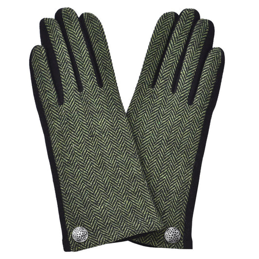 Pair of green herringbone patterned gloves with black cuffs on a white background
