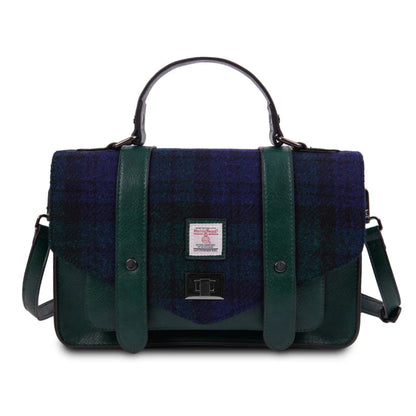 Blue and green checkered bag with leather straps on a white background