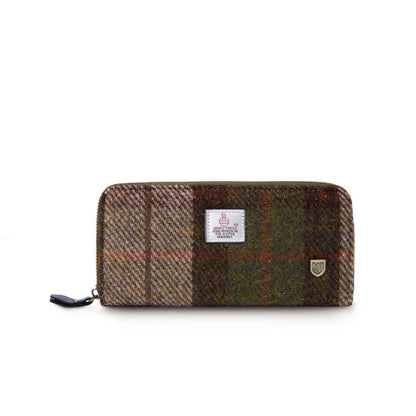 A green, brown, and beige checkered long zip purse made of Harris Tweed with a secure full zip closure.