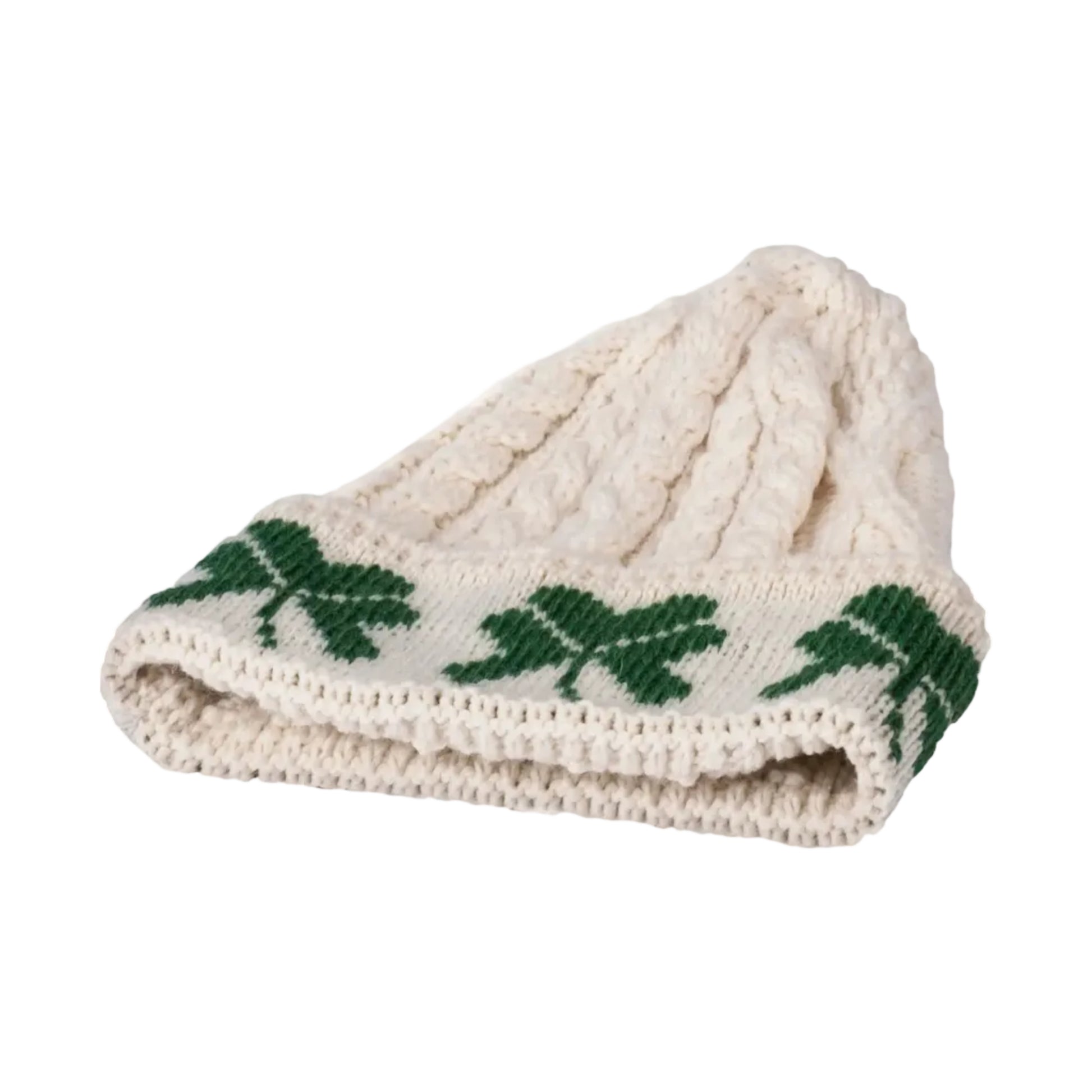 Knitted beanie with green leaf patterns on a white background