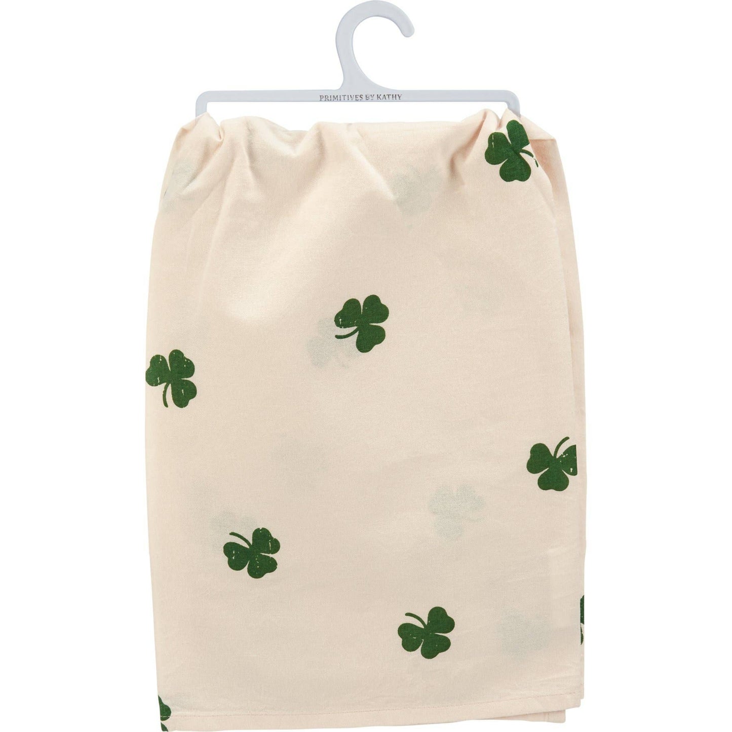 Beige towel with green shamrock patterns on a white background