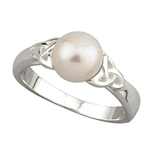 A silver ring featuring a central pearl with trinity knot designs on the band.