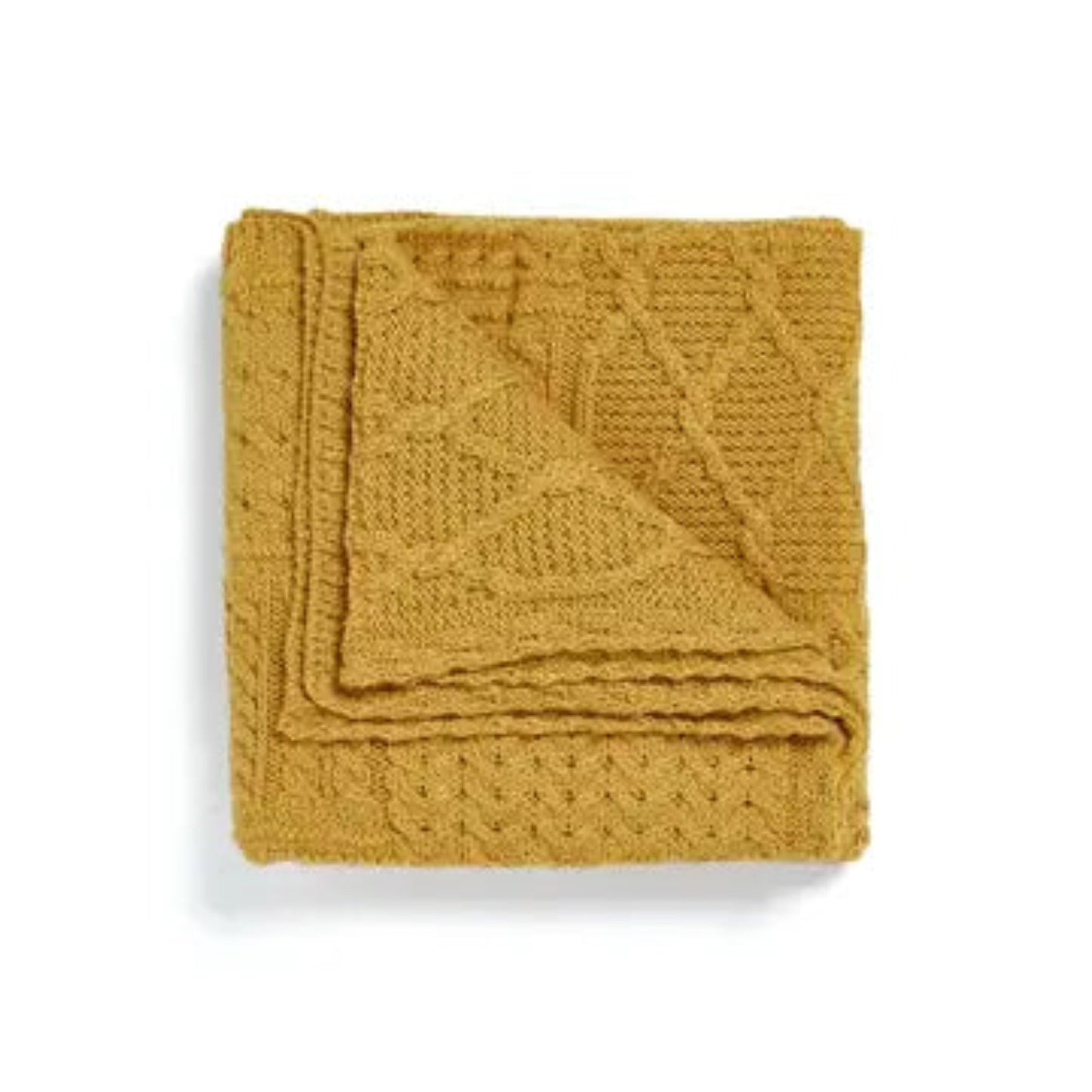 Mustard yellow knitted blanket on a white background