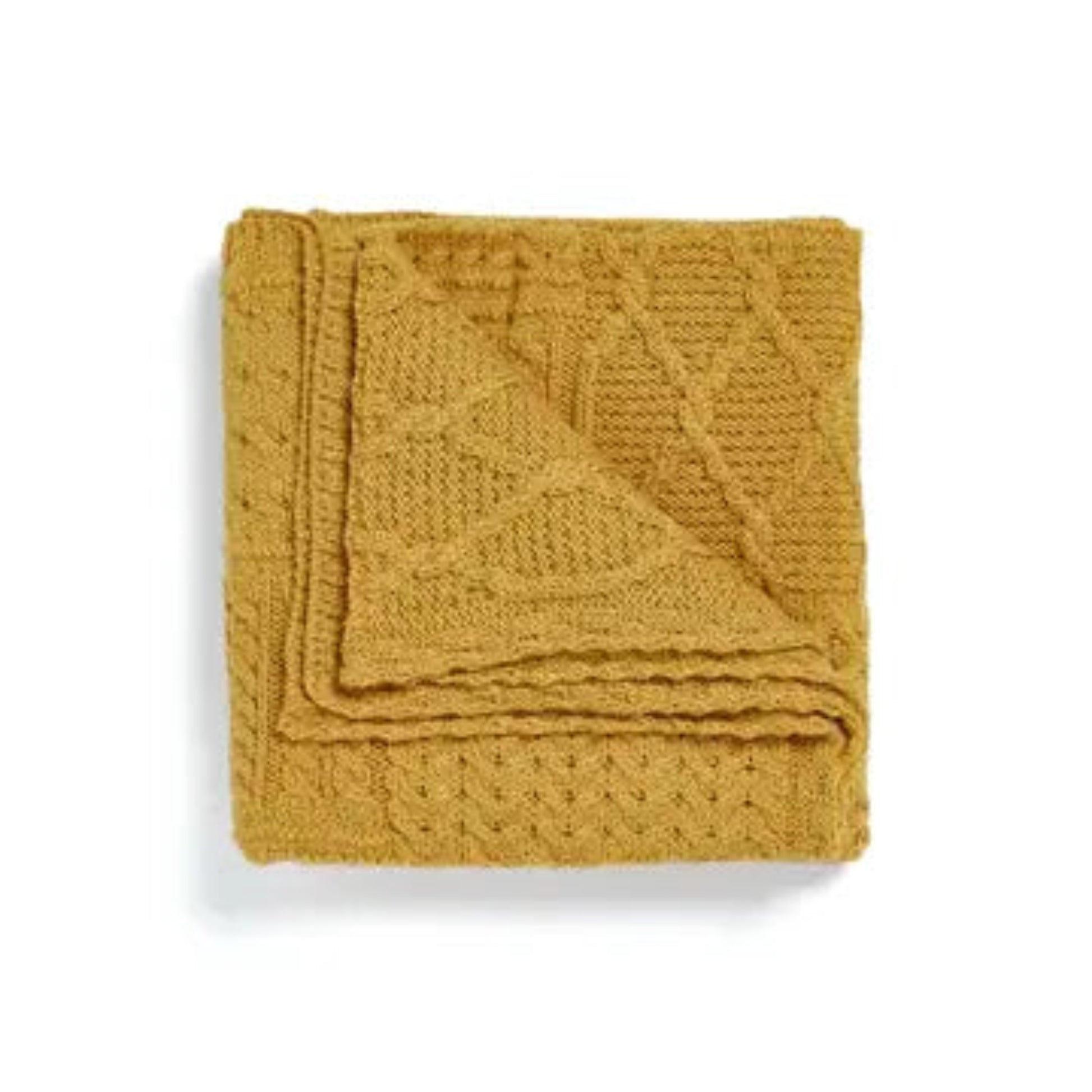 Mustard yellow knitted blanket on a white background