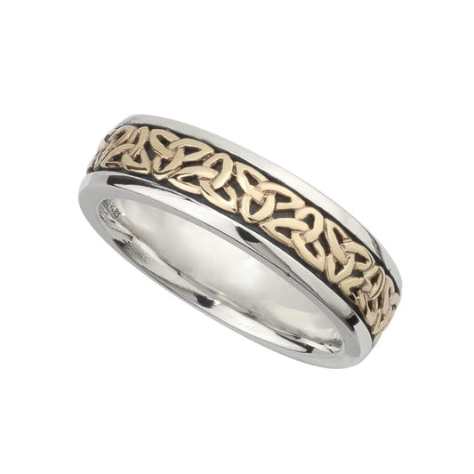Two-tone ring with silver and gold Celtic knot design on a white background
