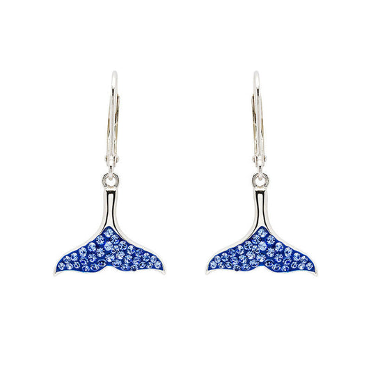 Whale tail earrings with blue gemstones on a white background
